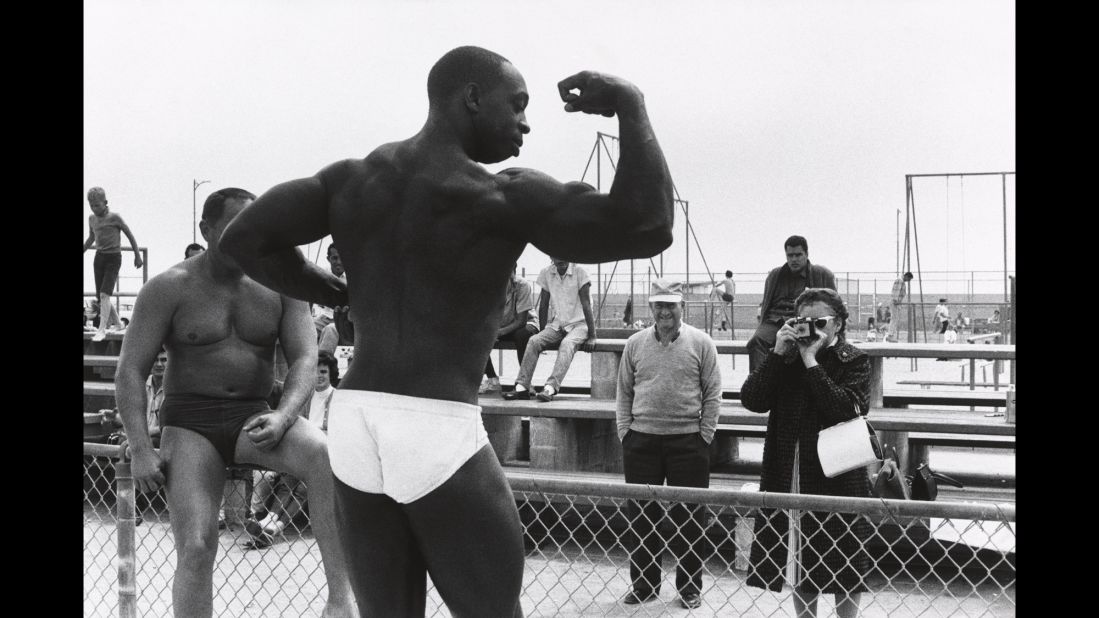 A bodybuilder flexes on Venice Beach. Esquire had sent Davidson to California with the idea that his photos would accompany an article written by someone like Tom Wolfe -- someone who represented an unconventional non-fiction writing style that was being called New Journalism.