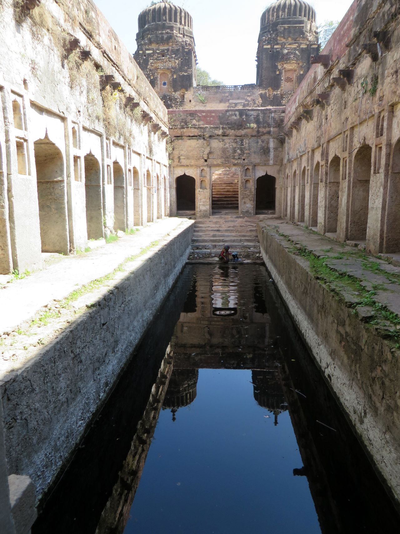 "A farm family cares for this stepwell, using it as it was in past centuries: for drinking, washing, and irrigation. It's large scale, huge entry towers, and architectural details make it another of my favorites -- an unexpected treasure way out in the countryside."