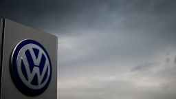 The logo of German car maker Volkswagen can be seen as dark clouds hang in the sky over a Volkswagen trader in Hanover, central Germany, on September 22, 2015. Share prices on the Frankfurt stock exchange fell more than 3.0 percent in midday trading on September 22, 2015, pushed down by index heavyweight Volkswagen, as it ploughed ever deeper into a pollution cheating scandal.   AFP PHOTO / DPA / JULIAN STRATENSCHULTE   +++   GERMANY OUT        (Photo credit should read JULIAN STRATENSCHULTE/AFP/Getty Images)