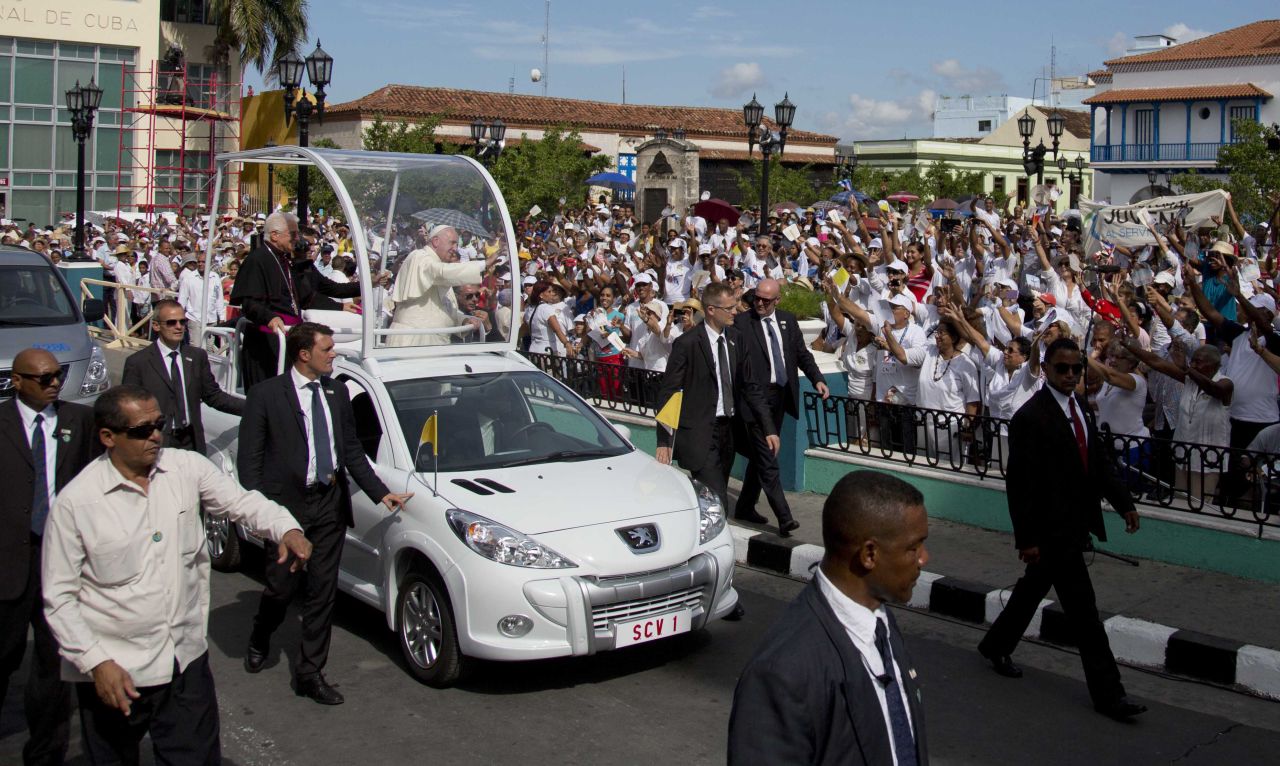 Security surrounds Pope Francis as makes his way to the Metropolitan Cathedral in Santiago, Cuba, on Tuesday, September 22. The Pope arrived in Cuba on Saturday and is scheduled to travel to the United States on Tuesday.