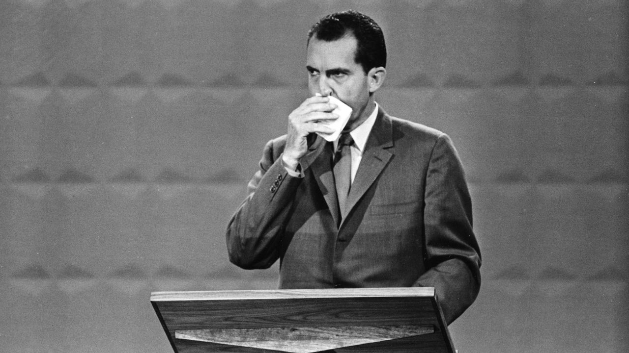 Nixon wipes his face with a handkerchief during the debate.