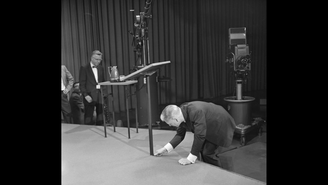 CBS President Frank Stanton fixes the debate stage.