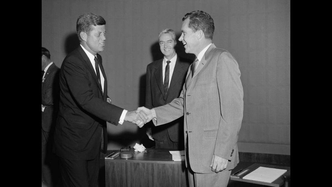 The candidates shake hands as moderator Howard K. Smith looks on. The one-hour debate took place in Chicago at the studios of CBS affiliate WBBM.