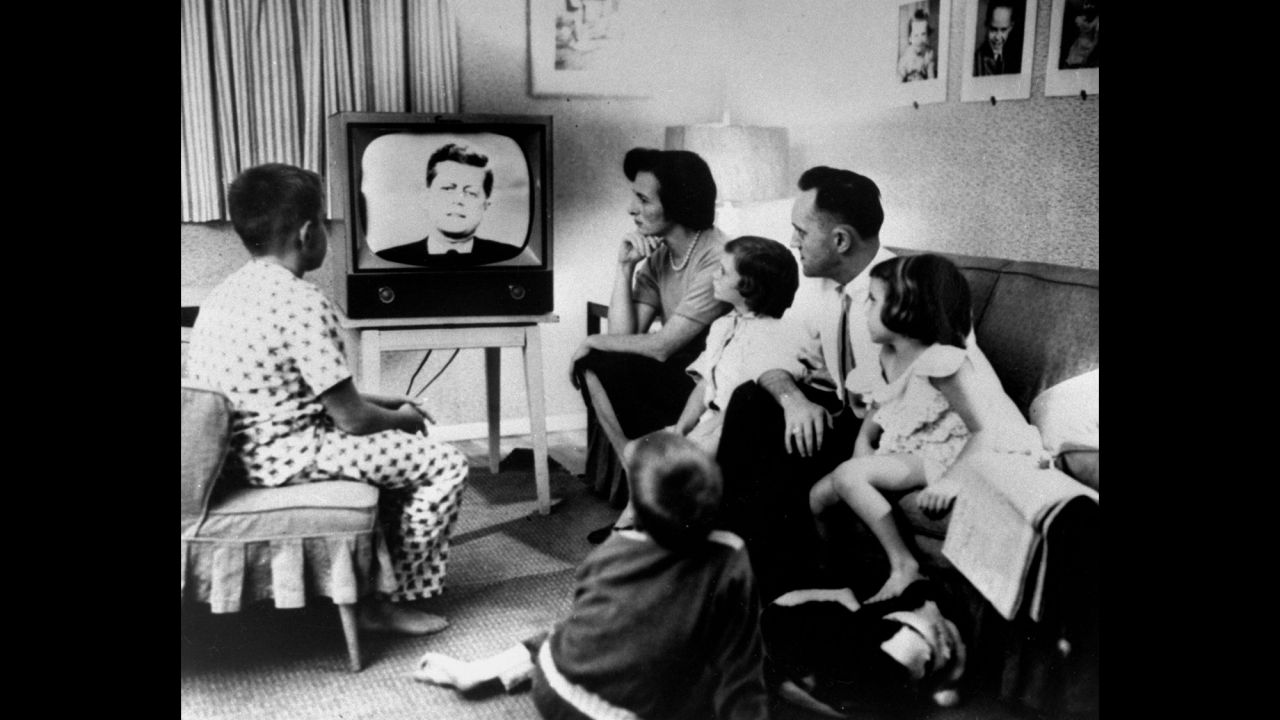 A family gathers around a television to watch the debate. More than 66 million people watched out of a population of about 180 million. "I don't think it's overstating the fact that, on that date, politics and television changed forever," said Bruce DuMont, a nationally syndicated radio talk show host and president of the Museum of Broadcast Communications. "After that debate, it was not just what you said in a campaign that was important, but how you looked saying it."