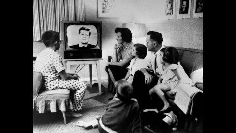 A family gathers around a television to watch the debate. More than 66 million people watched out of a population of about 180 million. "I don't think it's overstating the fact that, on that date, politics and television changed forever," said Bruce DuMont, a nationally syndicated radio talk show host and president of the Museum of Broadcast Communications. "After that debate, it was not just what you said in a campaign that was important, but how you looked saying it."