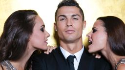 MADRID, SPAIN - SEPTEMBER 09:  Cristiano Ronaldo poses with models as he unveils his debut fragrence 'Cristiano Ronaldo Legacy' at a launch party on September 9, 2015 in Madrid, Spain.  (Photo by Getty Images for Cristiano Ronaldo Legacy)