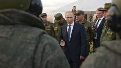 Russian President Vladimir Putin, center, meets with officers after military exercises at Donguz range in Orenburg region, about 1300 kilometers (800 miles) southeast of Moscow, Russia, Saturday, Sept. 19, 2015. Russian President Vladimir Putin on Saturday signaled his intentions to establish a Russian military air base in neighboring Belarus. (Alexei Nikolsky/RIA-Novosti, Kremlin Pool Photo via AP)