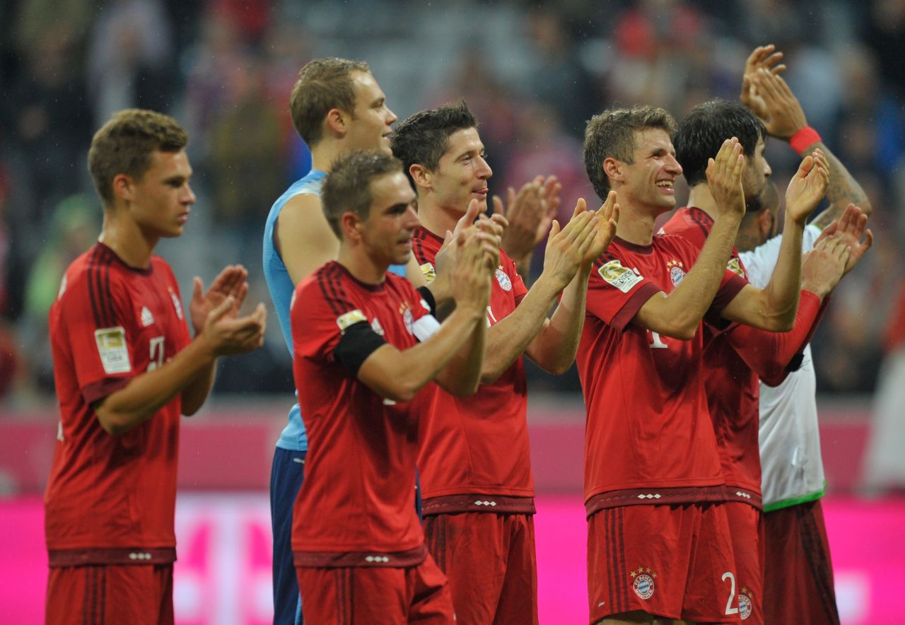 Lewandowski and his Bayern teammates celebrate at the end of the game as they mark the Polish striker's mesmerizing individual performance.