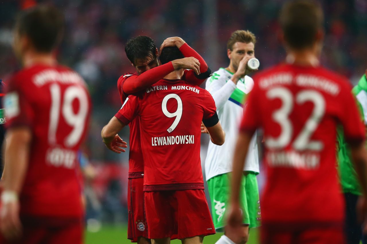 Javi Martinez hugs teammate Lewandowski after the Pole's barnstorming performance, which saw five goals come in nine minutes early in the second half. 