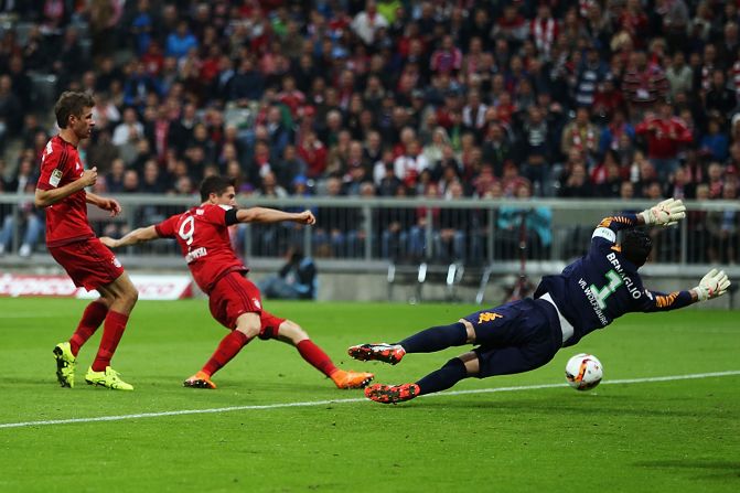 Lewandowski scores his team's first goal against Wolfsburg. HIs second, a superbly-taken shot from outside the penalty area, came just a minute later.
