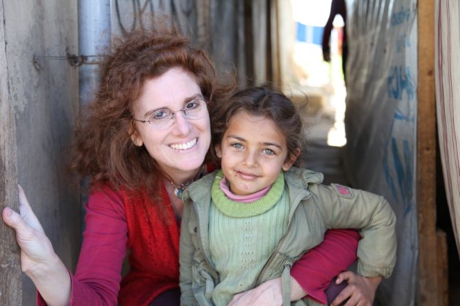 Barbara Massaad poses with a refugee child at the Zahle Lebanon. Her experience at the camp inspired her to create the humanitarian cookbook "Soup for Syria."