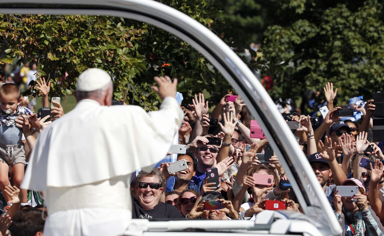 Pope Francis greets crowds during his parade in Washington on September 23.