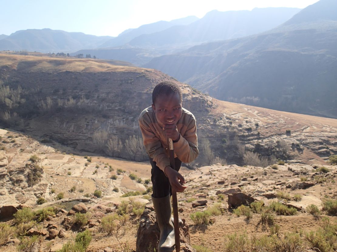 Rutland had lived in Asia and Europe but never seen much of his own continent. Pictured, a boy poses for Rutland's camera in one of Lesotho's mountains.