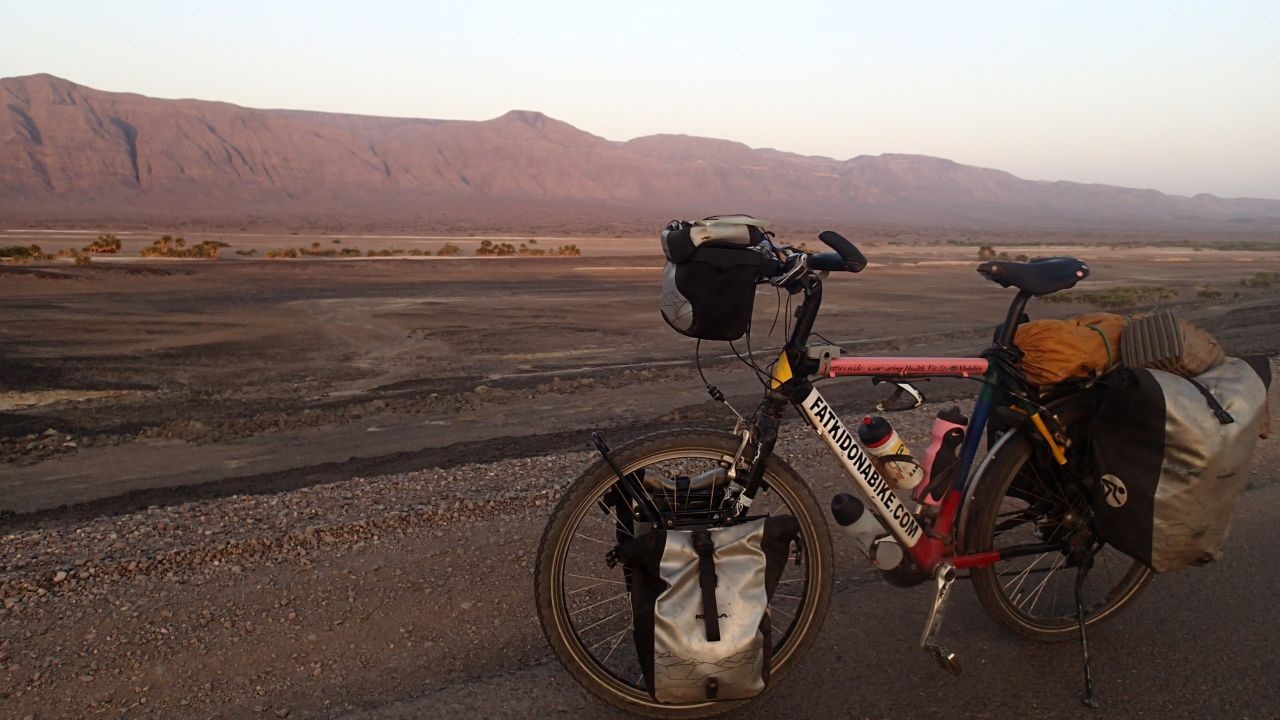 Resting the bike in Djibouti. Rutland says the pressure of needing to finish in time for the Rugby World Cup spurred him on through exhaustion.