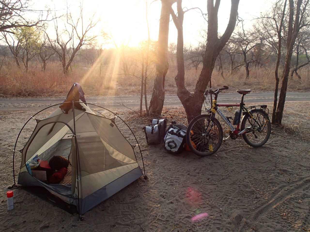 Rutland's bicycle and second tent, camped in the Ugandan bush. He lost his first tent in a fire on his first night in the Mozambique bush, which he started by knocking over his gas stove. 