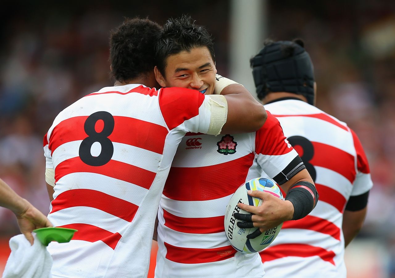 Japan players celebrate the try by Mafi, who was one of six changes to the side made by coach Eddie Jones following the win over South Africa.