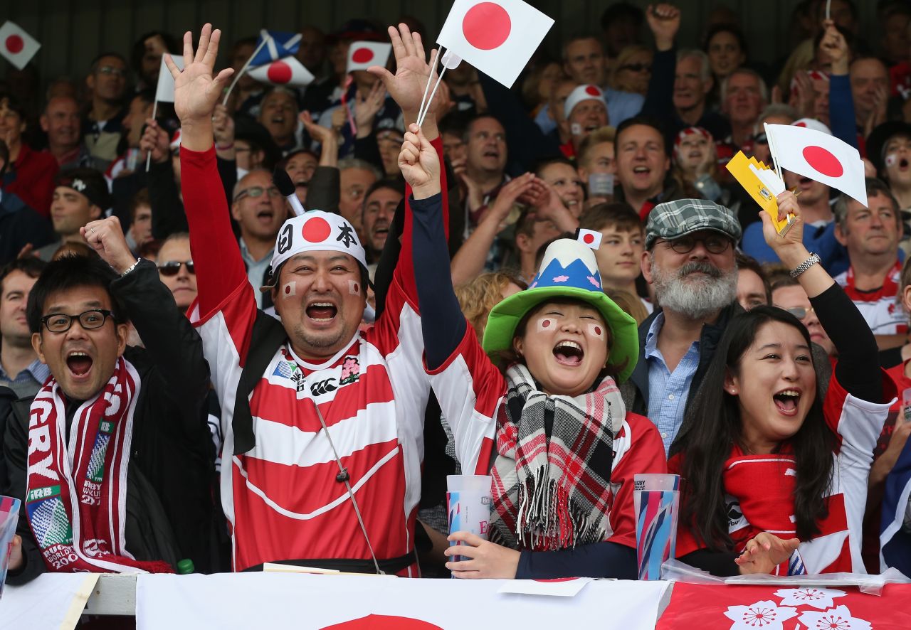 Japan supporters celebrate Mafi's try against Scotland.