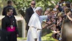 Pope Francis greets well-wishers as he leaves the Apostolic Nunciature to the United States to go to the Basilica of the National Shrine of the Immaculate Conception on September 23, 2015 in Washington, DC.  AFP PHOTO/MOLLY RILEY        (Photo credit should read MOLLY RILEY/AFP/Getty Images)