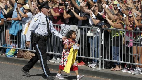 Sophie Cruz is escorted away before being called over by the Pope.