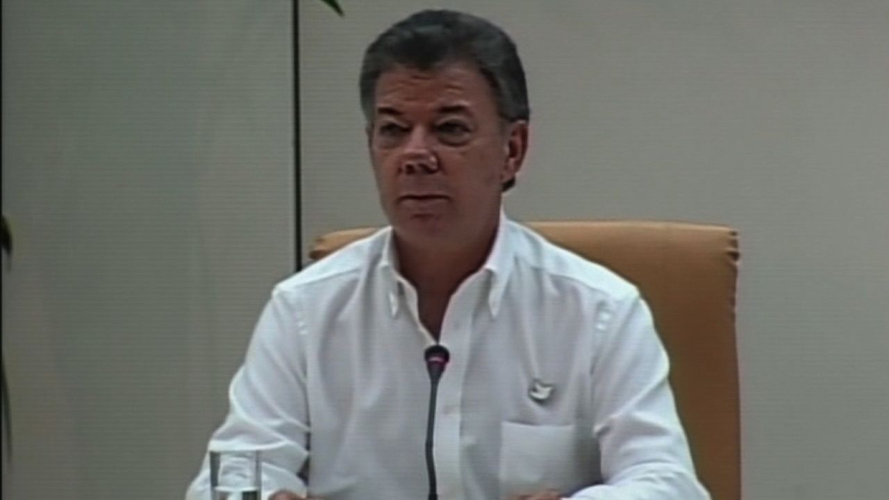 COLOMBIA'S PRESIDENT JUAN MANUEL SANTOS AT PRESSER ANNOUNCING PEACE PROCESS WITH FARC.