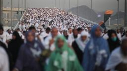 Hundreds of thousands of Muslim pilgrims make their way to cast stones at a pillar symbolizing the stoning of Satan, in a ritual called "Jamarat," the last rite of the annual hajj, on the first day of Eid al-Adha, in Mina near the holy city of Mecca, Saudi Arabia, Thursday, Sept. 24, 2015. (AP Photo/Mosa'ab Elshamy)