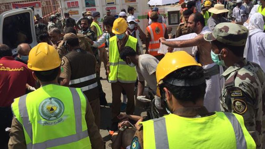 In this image posted on the official Twitter account of the directorate of the Saudi Civil Defense agency, rescuers respond to a stampede that killed and injured pilgrims in the holy city of Mina during the annual hajj pilgrimage on Thursday, Sept. 24, 2015. (Directorate of the Saudi Civil Defense agency via AP) MANDATORY CREDIT