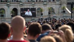People watch Pope Francis address a Joint Session of Congress in front of the US Capitol in Washington, DC, on September 24, 2015 on the third day of his six-day visit to the US.  AFP PHOTO/NICHOLAS KAMM        (Photo credit should read NICHOLAS KAMM/AFP/Getty Images)