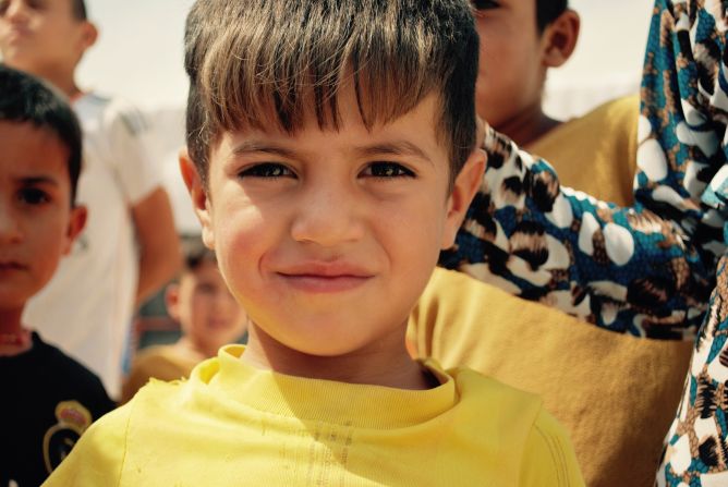 The Sharia Camp in Dohuk, Iraq houses 18,575 people in 4000 tents. It opened in 2014 and includes four schools -- two Arabic, two Kurdish. Many residents have escaped from their home in Sinjar after ISIS invaded and captured many Yazidis. Three-year-old Farhad Naifg is from Sinjar. He has been living in the camp for a year.<br />