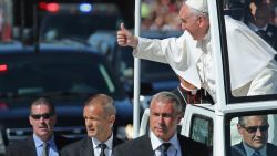 WASHINGTON, DC - SEPTEMBER 23:  Pope Francis leans out and waves to the crowd as he rides in a popemobile along a parade route around the National Mall on September 23, 2015 in Washington, DC. Thousands of people gathered near the Ellipse to catch of glimpse of Pope Francis after he addressed an audience of 15,000 invited guests on the South Lawn of the White House during an official arrival ceremony with President Barack Obama. The Pope began his first trip to the United States at the White House followed by a visit to St. Matthew's Cathedral, and will then hold a Mass on the grounds of the Basilica of the National Shrine of the Immaculate Conception.   (Photo by Chip Somodevilla/Getty Images)