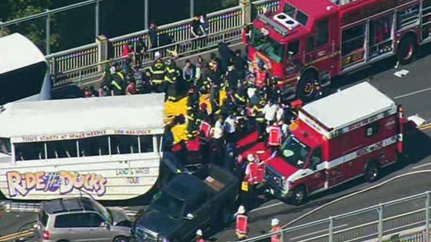 SEATTLE - All lanes of the Highway 99 Aurora Bridge are closed after a "Ride the Ducks' vehicle plowed into the side of a charter bus, officials said.   Several people were injured in the crash, according to unconfirmed reports.   Police and medics rushed to the scene at about 11:05 a.m. Thursday after receiving reports of a serious crash.