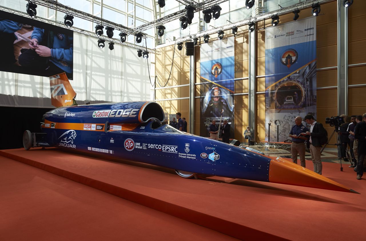This supersonic car mixes automobile and aircraft technology. It's powered by a jet engine and a rocket together with a petrol engine auxiliary power unit.