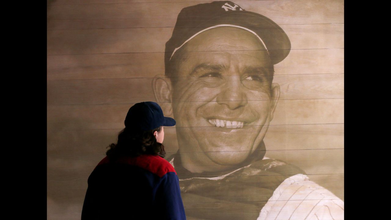 A visitor at the Yogi Berra Museum looks at a portrait of the former baseball great Wednesday, September 23, in Little Falls, New Jersey. Berra, who was also known for <a href="http://www.cnn.com/2015/09/23/us/yogi-berra-yogisms/" target="_blank">his wacky way with words</a>, died Tuesday, September 22. He was 90.