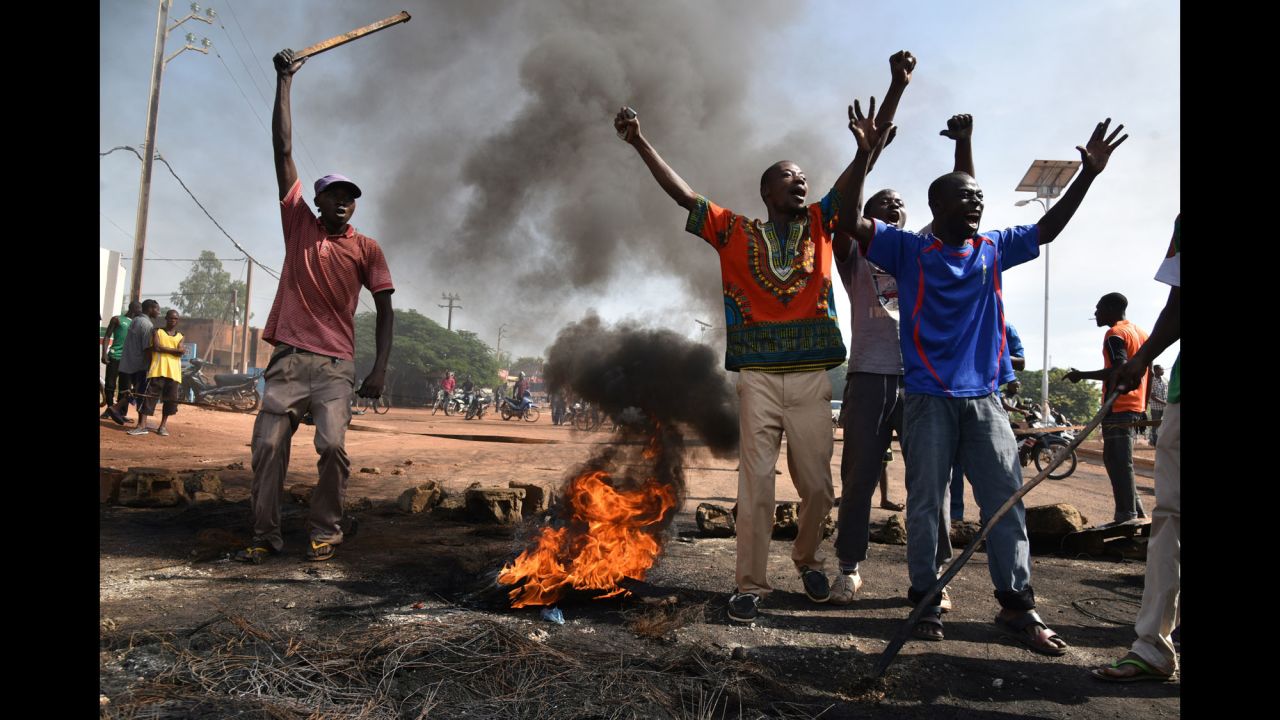 People protest next to a burning tire Monday, September 21, in Ouagadougou, Burkina Faso. The U.S. State Department <a href="http://www.cnn.com/2015/09/22/africa/burkina-faso-coup/" target="_blank">recommended that U.S. citizens leave the West African nation</a> as leaders of a recent coup faced domestic and international pressure to lay down their arms.
