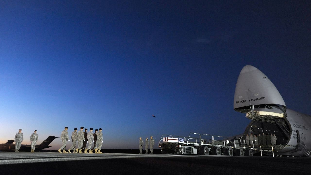 Members of the U.S. Army carry the remains of Spc. Kyle E. Gilbert at Dover Air Force Base in Delaware on Wednesday, September 23. Gilbert, a 24-year-old from Buford, Georgia, died two days earlier while serving in Afghanistan, according to the Department of Defense.
