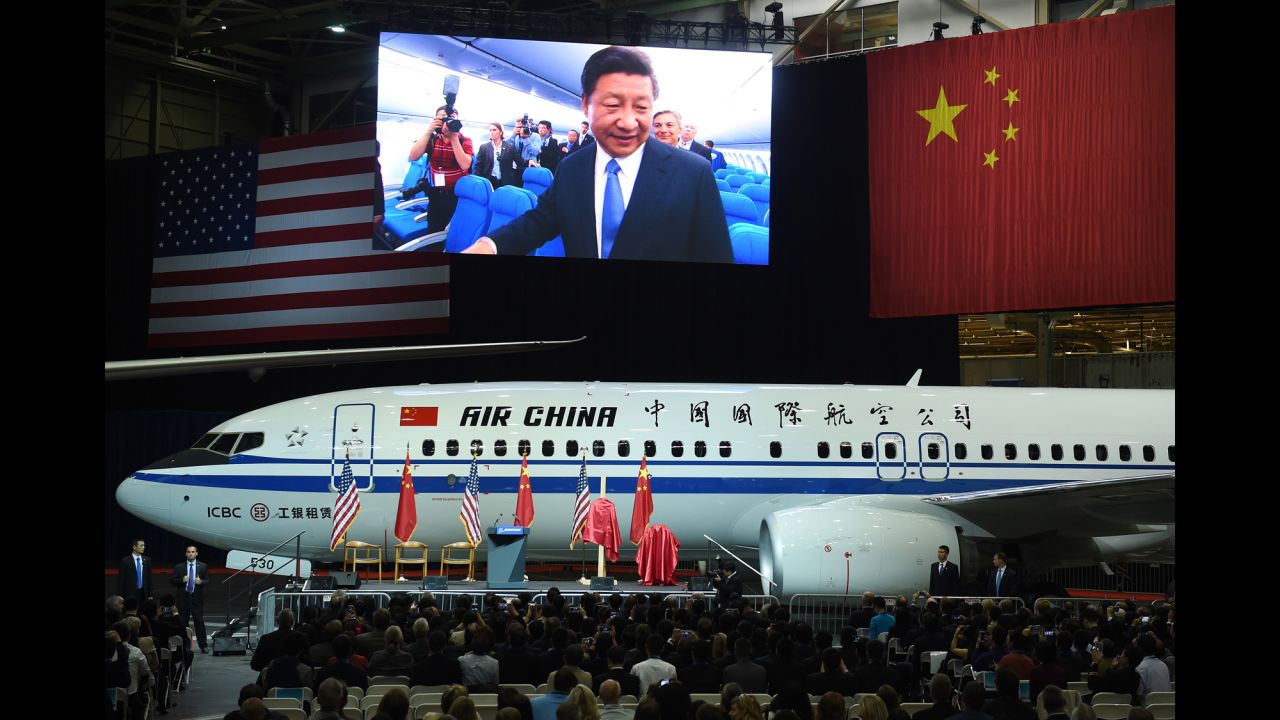 Chinese President Xi Jinping is pictured on a giant screen as he tours a jet Wednesday, September 23, at the Boeing assembly line in Everett, Washington. Boeing and Xi announced that Chinese companies <a href="http://money.cnn.com/2015/09/23/news/companies/xi-jinping-tech-leaders/" target="_blank">have inked a deal</a> to buy 300 more Boeing planes this year.