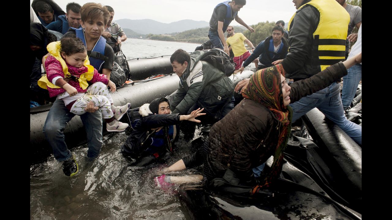 Migrants arrive at the Greek island of Lesbos after crossing the Aegean Sea from Turkey on Tuesday, September 22. 