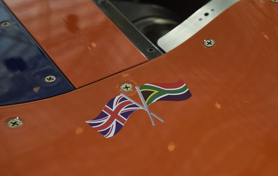 The British Union flag and the national flag of South Africa are seen on a panel of the Bloodhound Supersonic Car as it stands on display during a photocall to promote its World Debut, at Canary Wharf in east London.