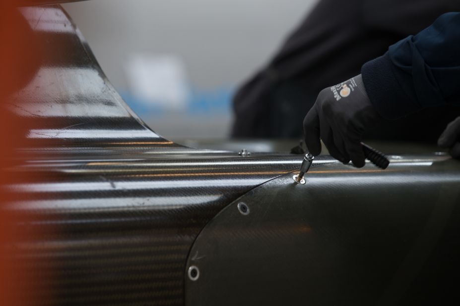 Engineers work on the carbon-fibre body of the Bloodhound SSC.