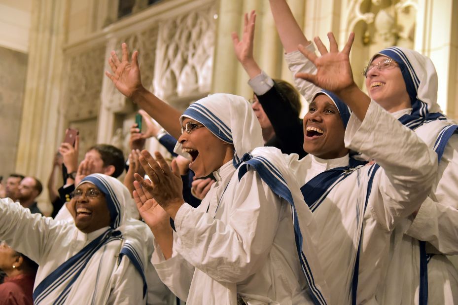 Nuns celebrate at St. Patrick's Cathedral as they wait for the arrival of Pope Francis.