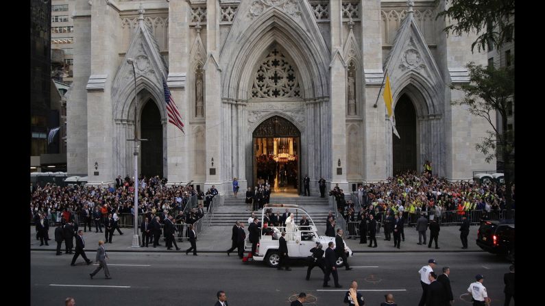 Francis greets crowdz as he arrives at St. Patrick's Cathedral.