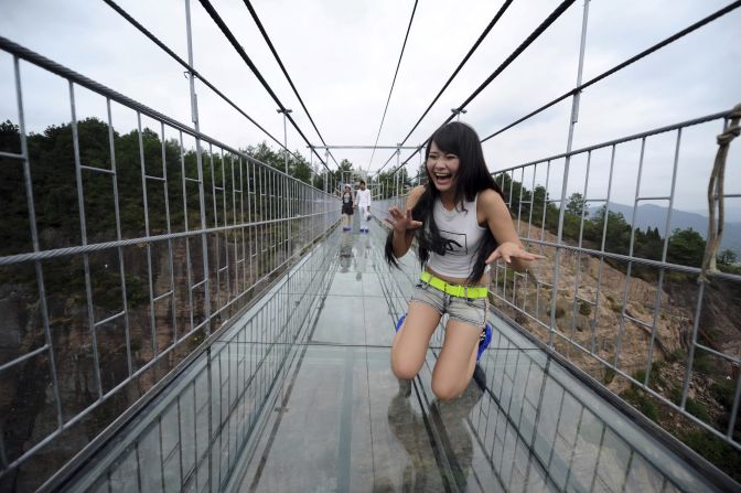 It's one of a series of glass-bottomed attractions China has opened lately. Another new bridge (as seen in the picture), called Haohan Qiao or Brave Men's Bridge in English, is a 300-meter-long overpass in Shiniuzai National Park in southern China.