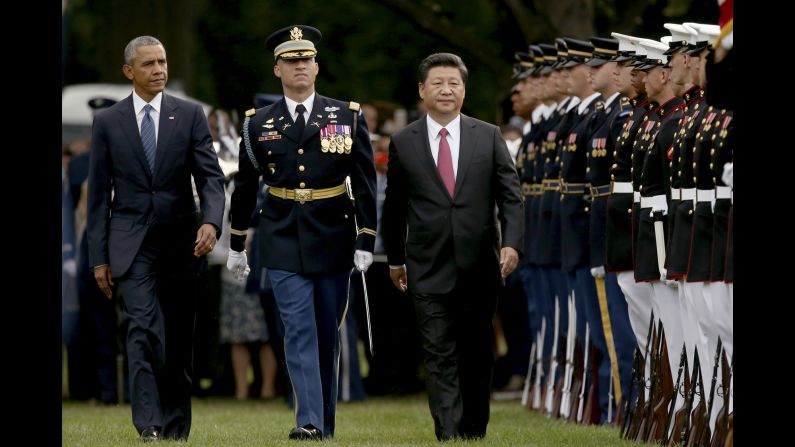 President Obama and President Xi walk on the South Lawn of the White House during a ceremony for Xi's official state visit on September 25.