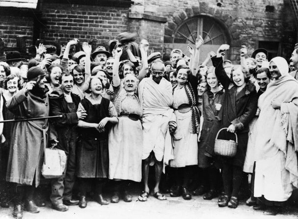 Gandhi is greeted by a crowd of female textile workers while visiting Darwen, England, in 1931. He had accepted an invitation from the mill-owning Davies family, <a href="https://www.bbc.com/news/uk-england-lancashire-15020097" target="_blank" target="_blank">who wanted Gandhi to see how his boycott was hurting their industry.</a> He told some of the workers that their conditions were nothing like the poverty in his country.