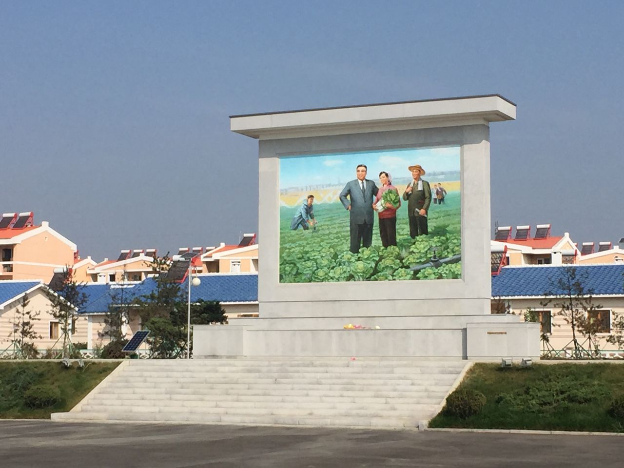 Jang Chon cooperative farm has a large, colorful mural of North Korean founder Kim Il Sung, a man whose portrait is omnipresent in every North Korean home and public building.