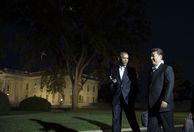 The two Presidents walk to a private dinner near the White House on Thursday, September 24.