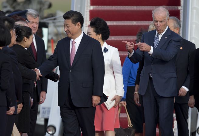 Vice President Joe Biden gestures as Xi and his wife are greeted at Joint Base Andrews in Maryland on September 24.
