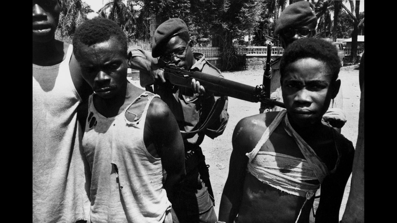 Suspected Lumumbist freedom fighters are tormented before execution in Stanleyville, Democratic Republic of Congo, in 1964.