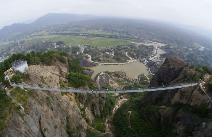 Hovering 180 meters over ground, the Shiniuzhai's span was originally made of wood. It's been converted to a glass walkway over the past year.