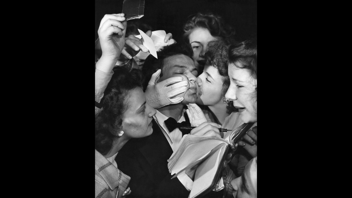 Always blessed with a gorgeous voice, Sinatra also knew how to make the best of it. (He purchased a microphone while still in his teens to practice his sound.) After years with various bands, Sinatra broke out in the 1940s as a teen idol. Here, kissing fans swarm Sinatra for autographs in 1943. 