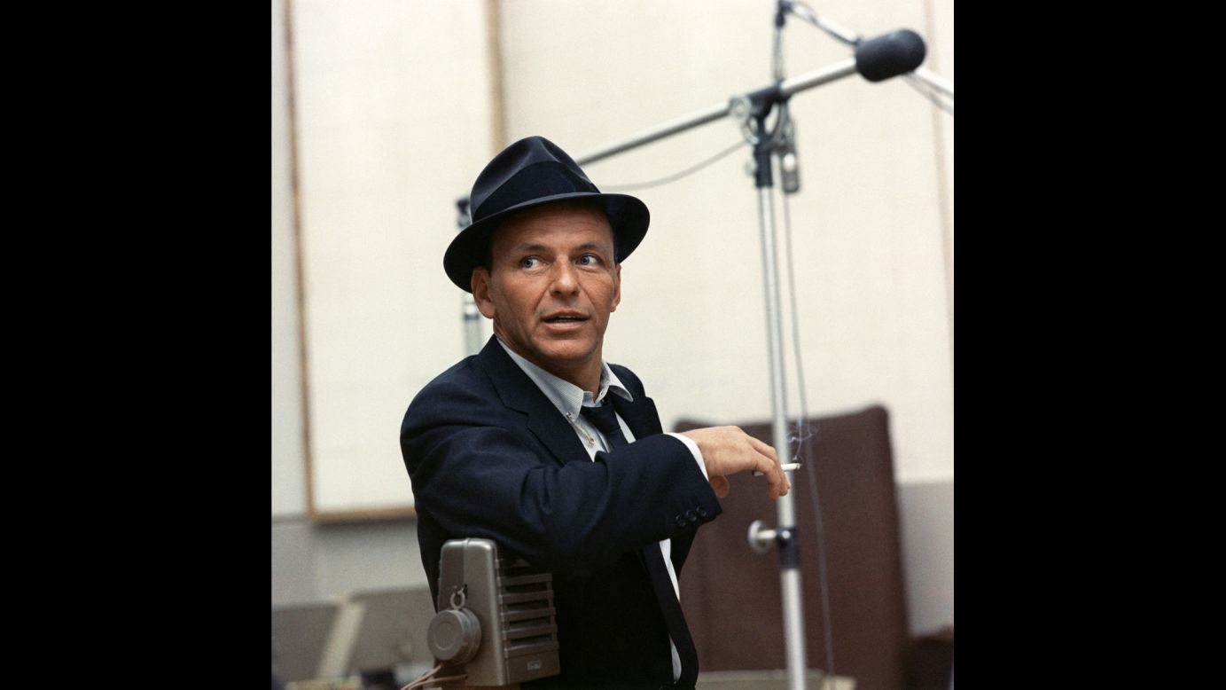 Sinatra also re-established his singing career with a new label, Capitol Records, for which he would record some of his greatest sides. His insouciant look -- loosened tie, tailored jacket, fedora angled just so -- became a trademark.